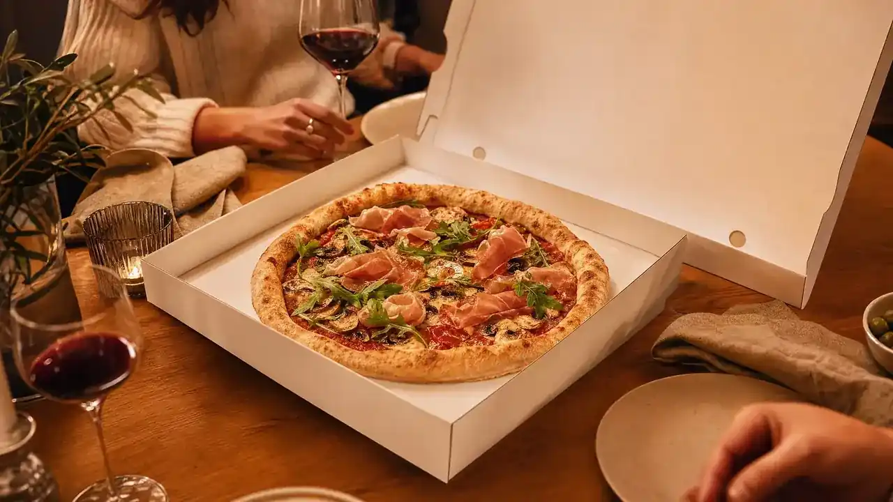 Premium pizza box on a family kitchen table